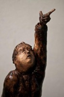 Pocketa Pocketa Pocketa (Come Sun Dance with Me), Ceramic, 30H x 8W x 7D Inches A ceramic sculpture by Michael Hermesh depicting a man in a raincoat reaching for the sky balancing precariously