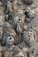 The Choir III, Ceramic, 11.75H x 11.5W inches A ceramic relief by Michael Hermesh that depicts a choir singing in monk's robes and mouse ears