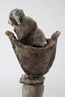 The Metaphysician, Ceramic, 9H x 3.5W x 3D inches A ceramic sculpture by Michael Hermesh depicting a man in a boat wearing a bird mask