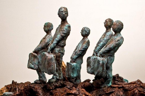 A ceramic sculpture by Michael Hermesh that depicts five passengers carrying suitcases standing on the backs of birds of prey that are riding in a boat